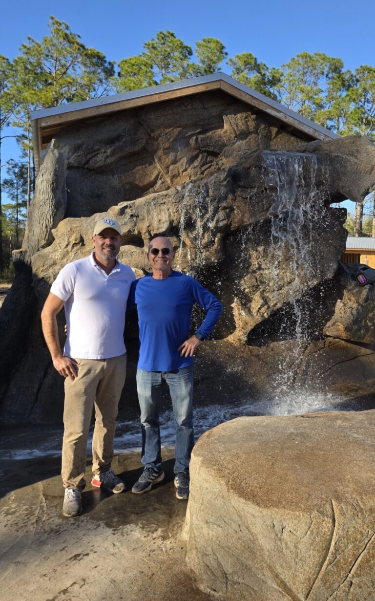 The Waterfall Builders with completed custom waterfall project