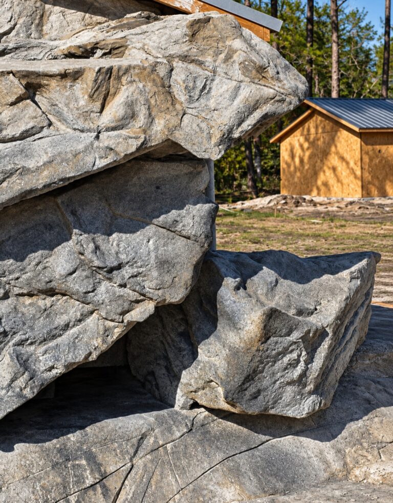 Hand-shaped cement panel rockwork textured to resemble natural stone